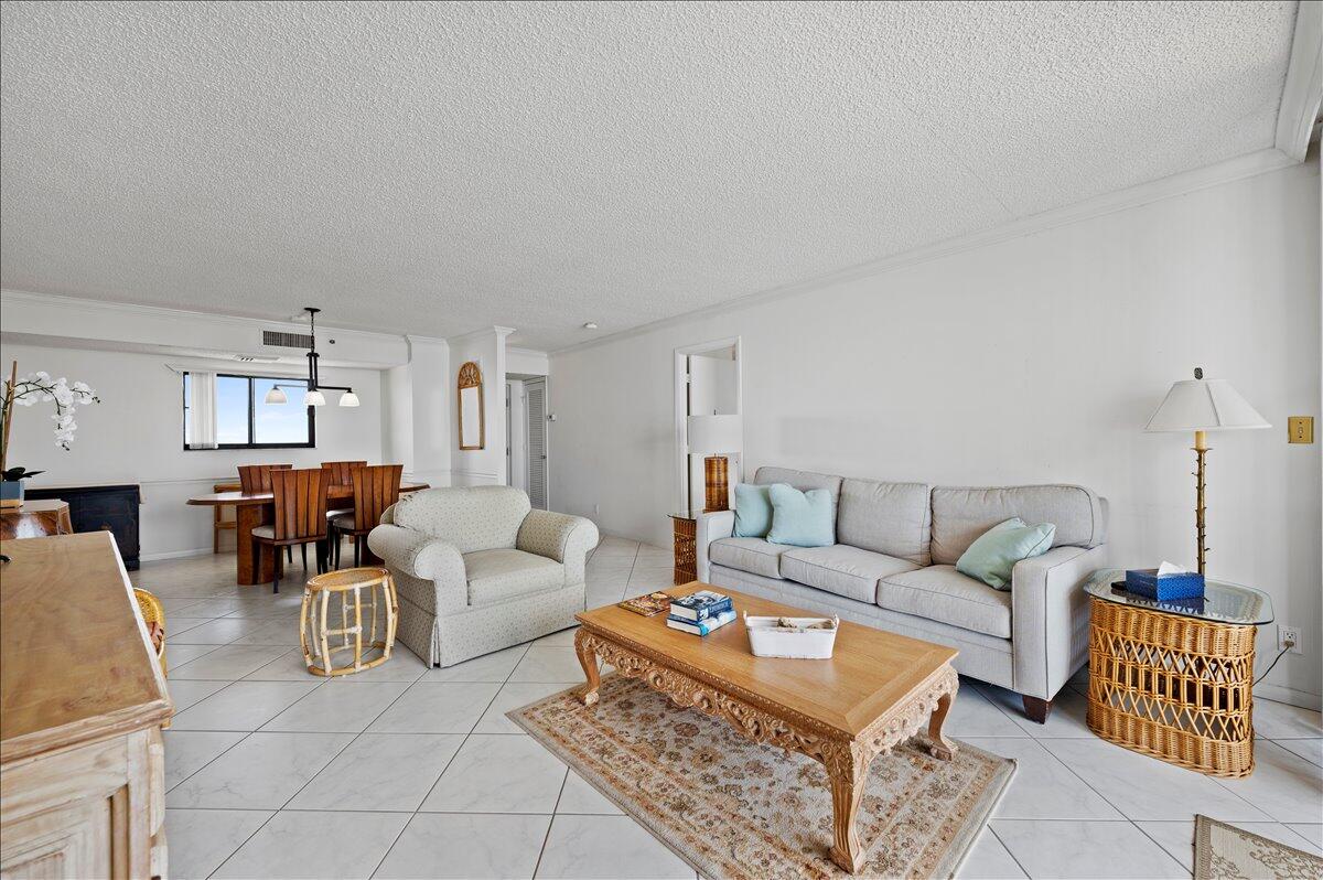 100 Ocean Trail Way, Unit 1403 Jupiter, FL 33477 - Photo 11 of 30 a living room with furniture a rug and a window