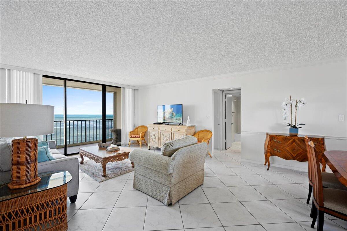 100 Ocean Trail Way, Unit 1403 Jupiter, FL 33477 - Photo 5 of 30 a living room with furniture and a window