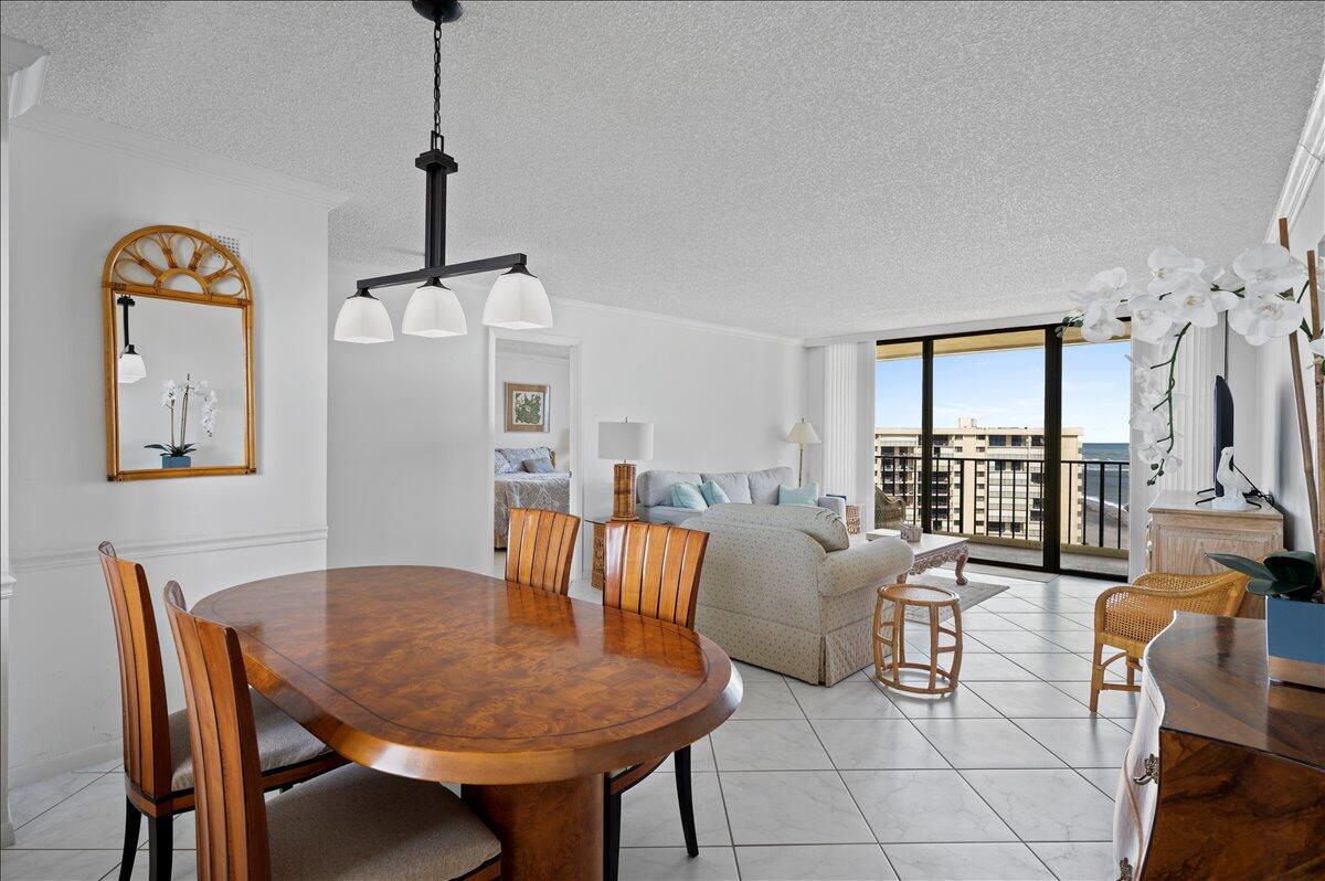 100 Ocean Trail Way, Unit 1403 Jupiter, FL 33477 - Photo 10 of 30 a view of a dining room with furniture