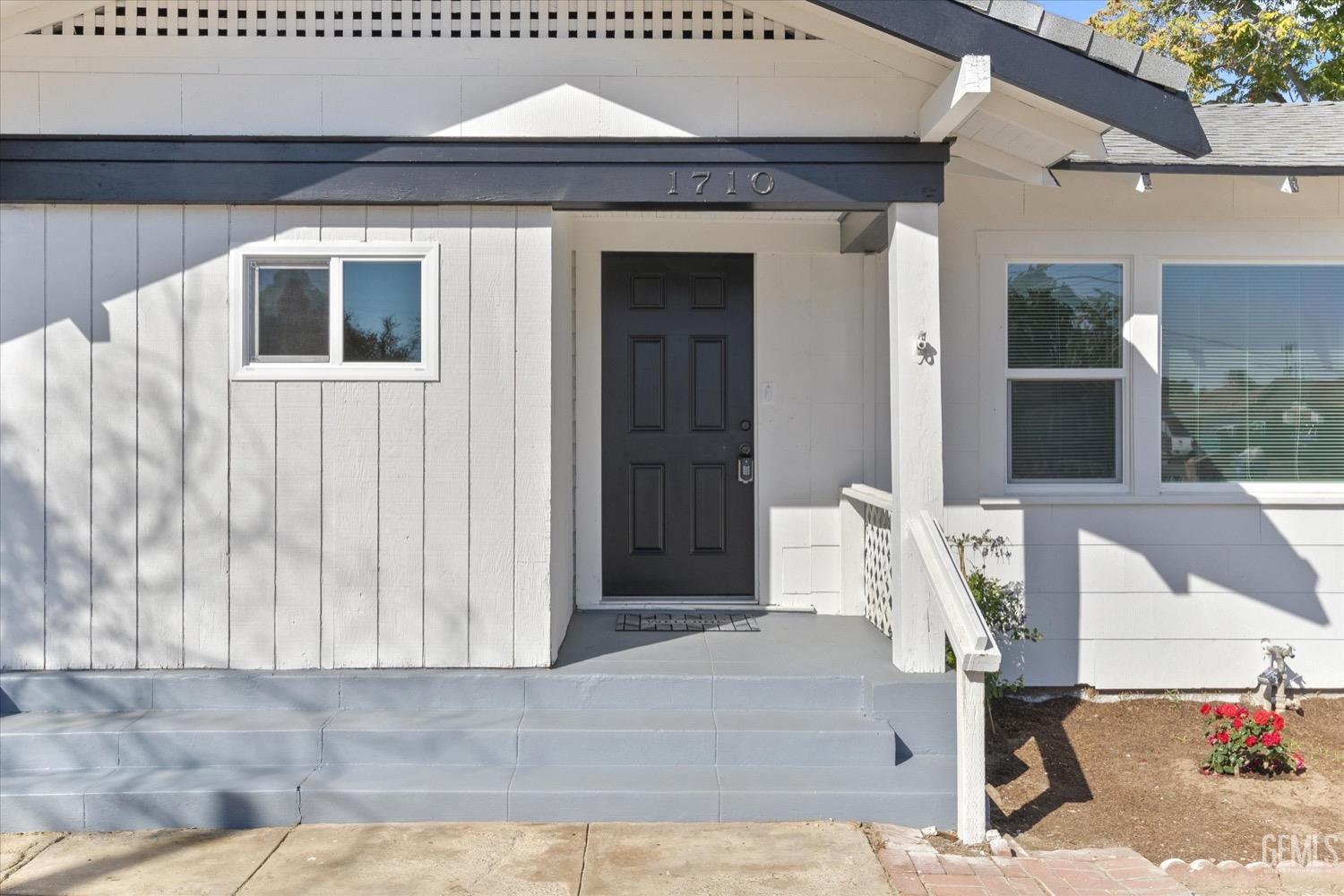 a front view of a house with a glass door