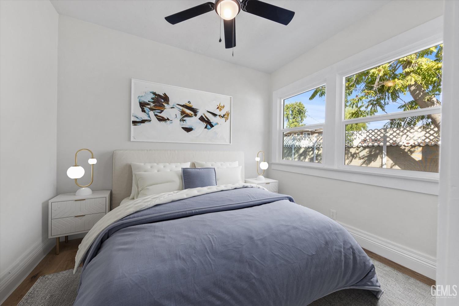 Undisclosed Address Bakersfield, CA 93304 - Photo 11 of 47 a bedroom with a bed and a window