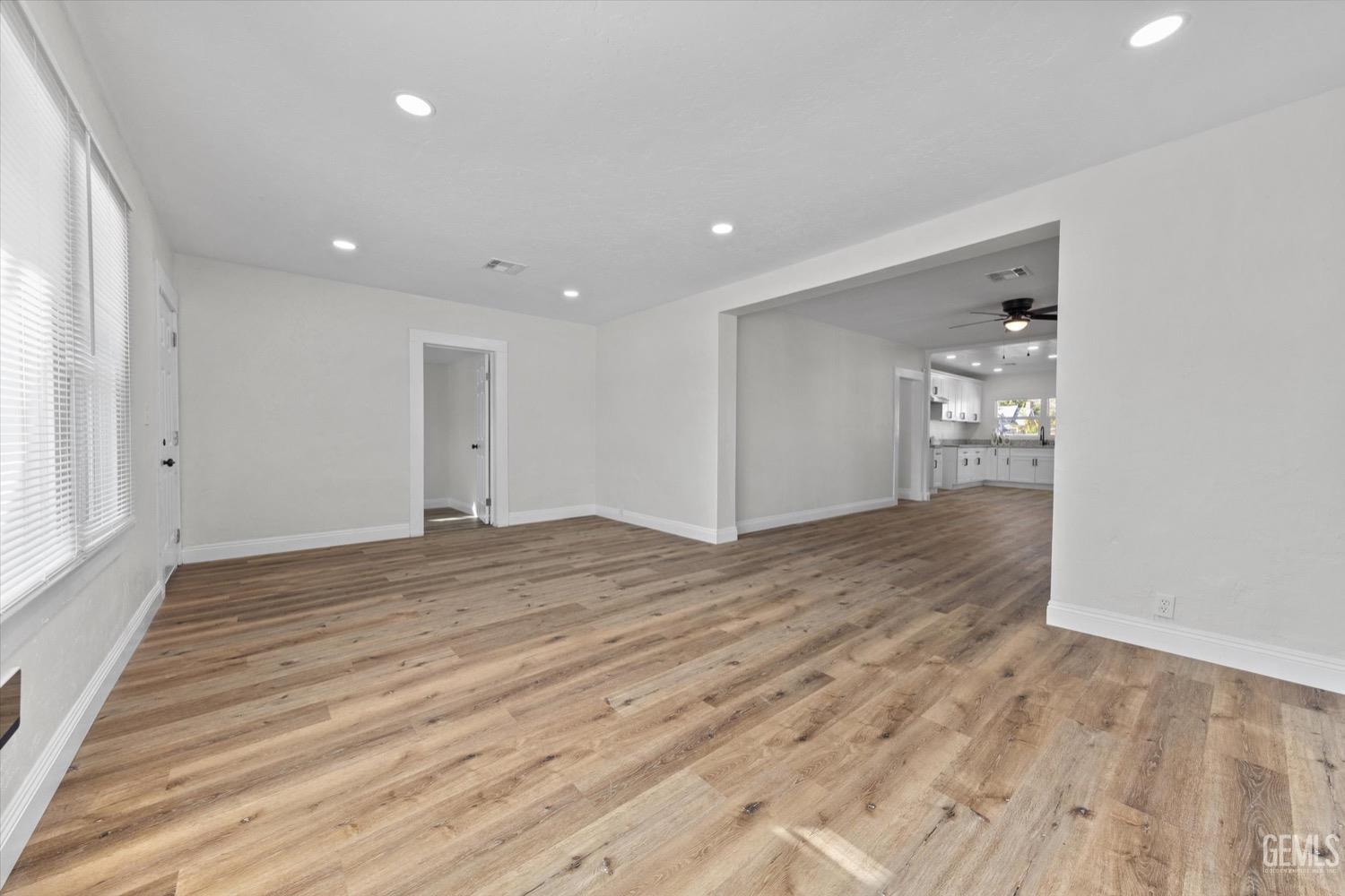 Undisclosed Address Bakersfield, CA 93304 - Photo 18 of 47 a view of empty room with wooden floor