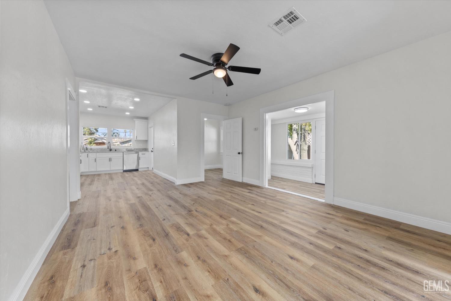 Undisclosed Address Bakersfield, CA 93304 - Photo 19 of 47 wooden floor in an empty room with a window