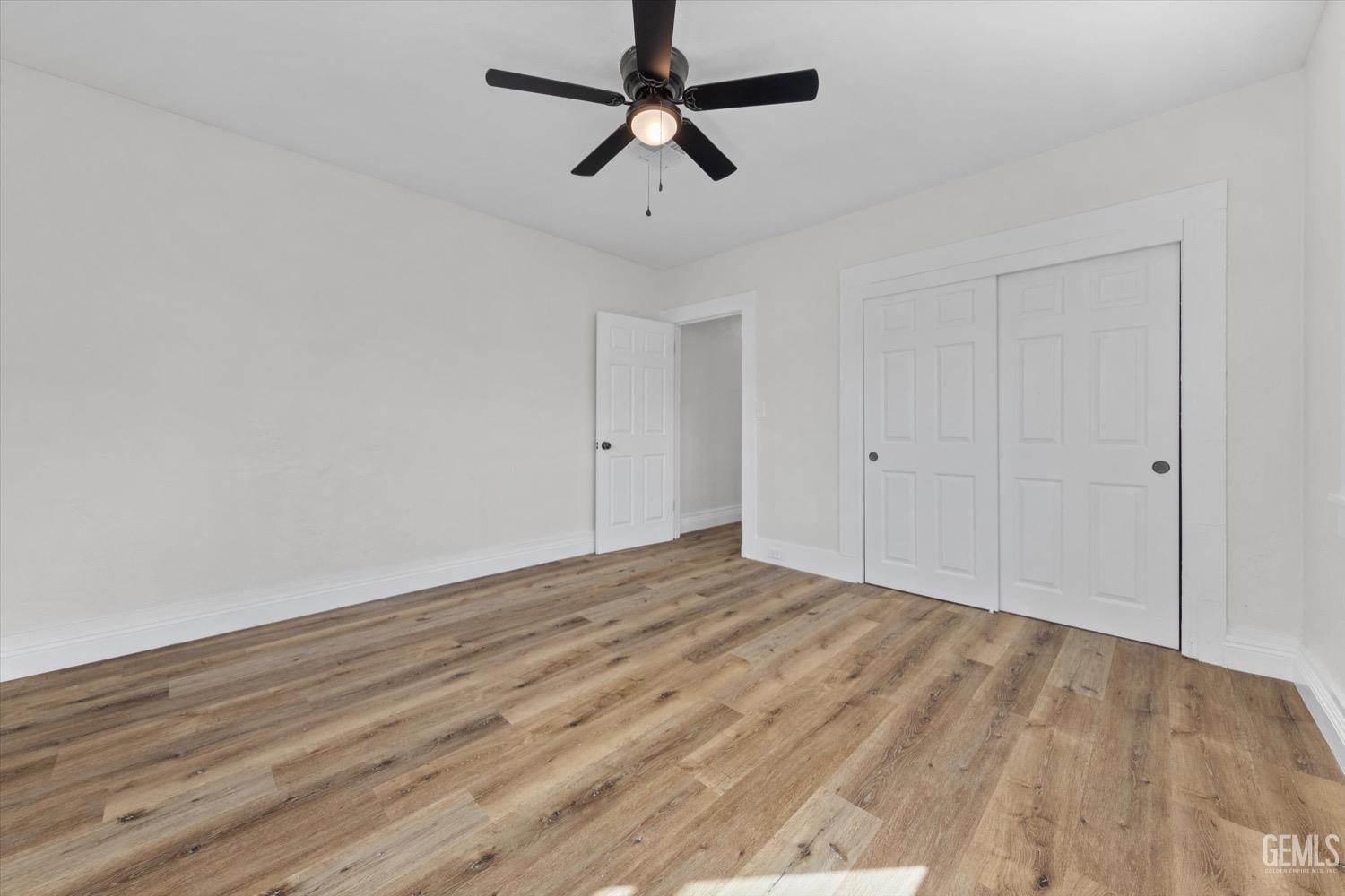 Undisclosed Address Bakersfield, CA 93304 - Photo 30 of 47 a view of empty room with wooden floor