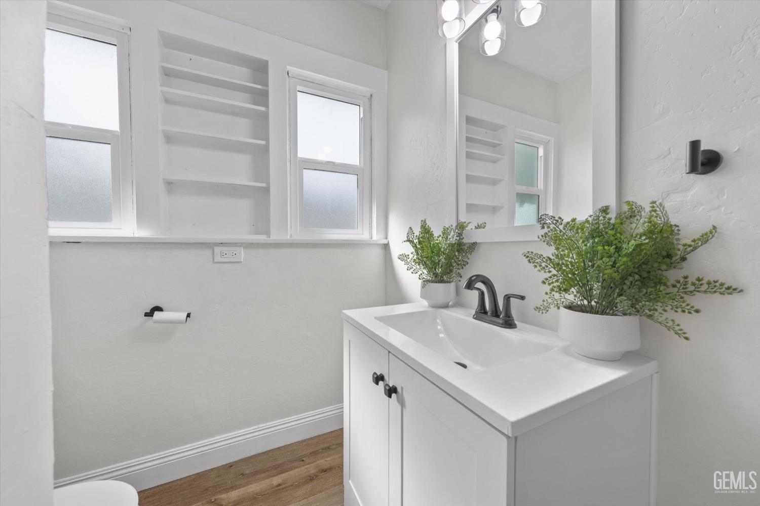 Undisclosed Address Bakersfield, CA 93304 - Photo 34 of 47 a bathroom with a sink and a mirror