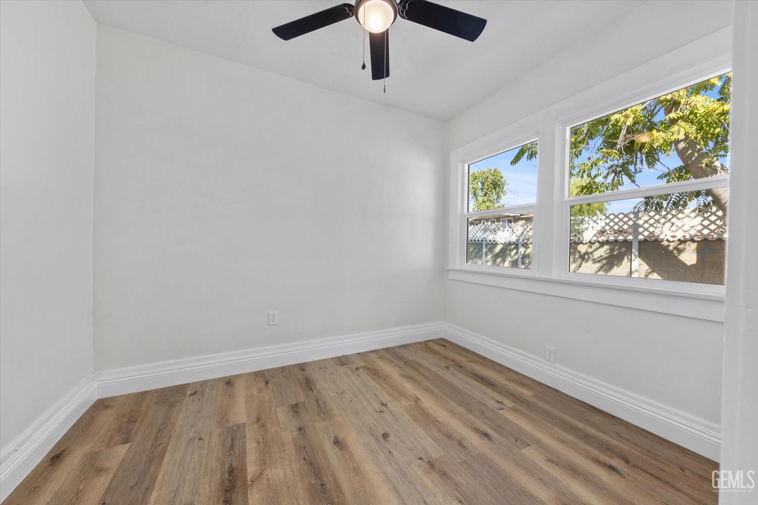 Undisclosed Address Bakersfield, CA 93304 - Photo 40 of 47 wooden floor in an empty room with a window