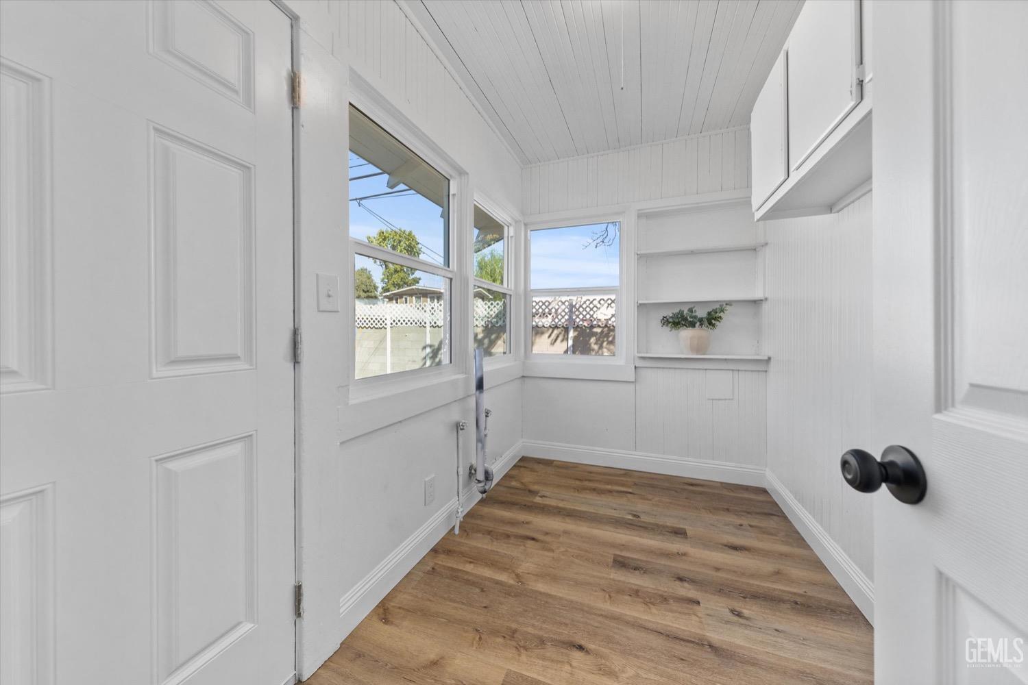 Undisclosed Address Bakersfield, CA 93304 - Photo 42 of 47 a room with cabinets and window