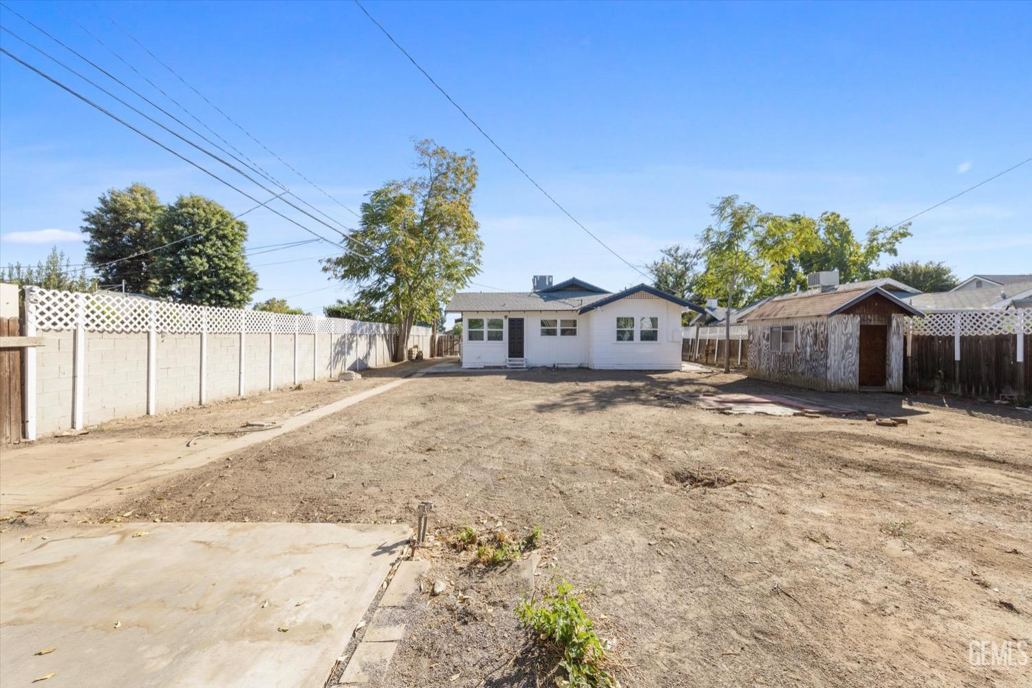 Undisclosed Address Bakersfield, CA 93304 - Photo 45 of 47 a front view of a house with a yard