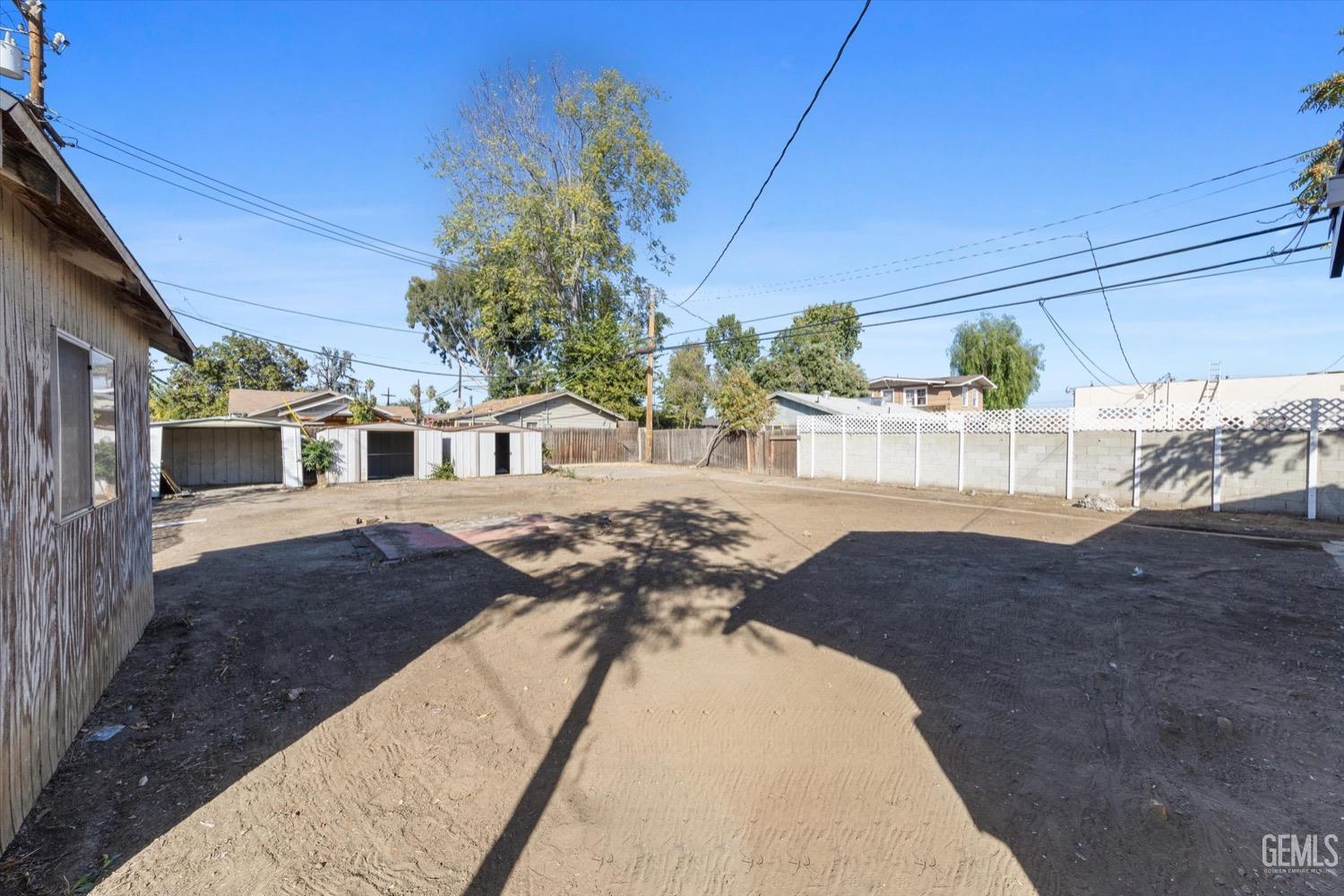 Undisclosed Address Bakersfield, CA 93304 - Photo 46 of 47 a front view of a house with a yard