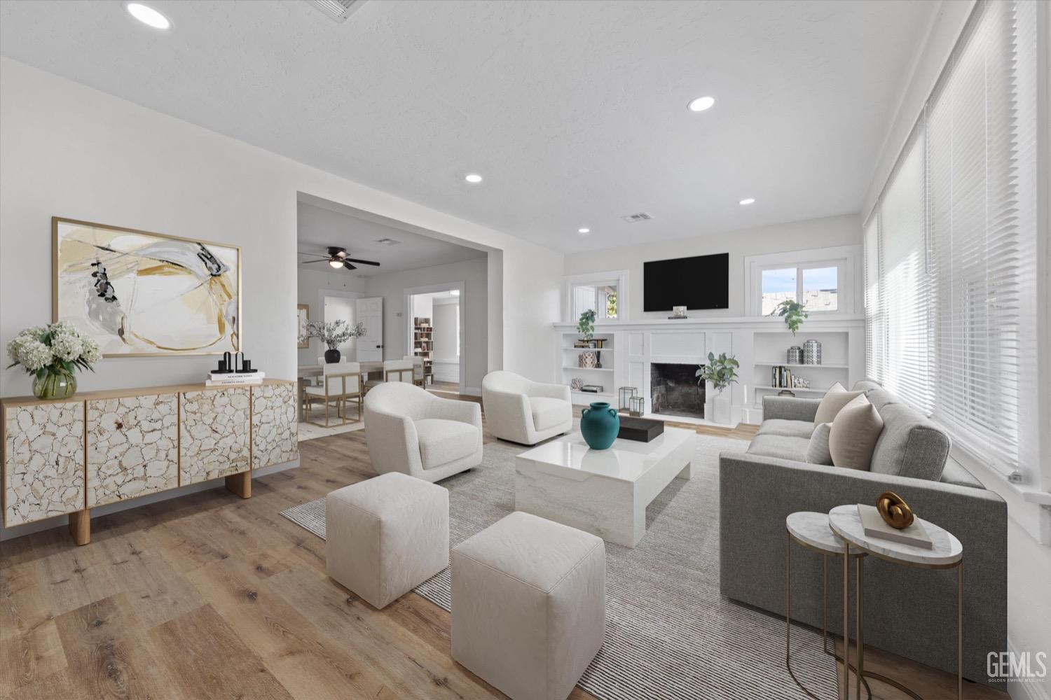 Undisclosed Address Bakersfield, CA 93304 - Photo 5 of 47 a living room with furniture a fireplace and a flat screen tv