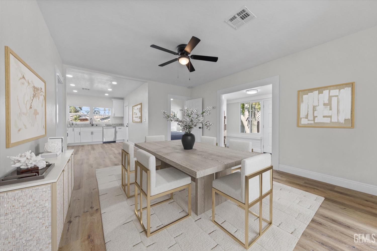 Undisclosed Address Bakersfield, CA 93304 - Photo 7 of 47 a view of a dining room with furniture and a chandelier fan