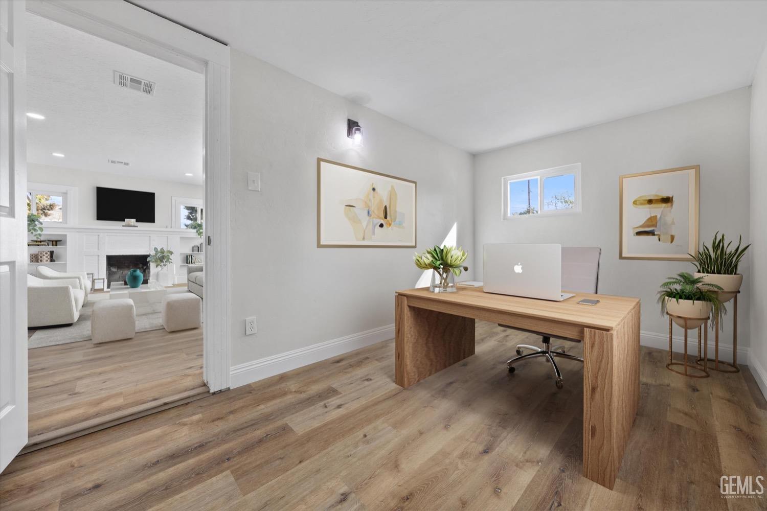 Undisclosed Address Bakersfield, CA 93304 - Photo 8 of 47 a view of a workspace with wooden floor and a workspace