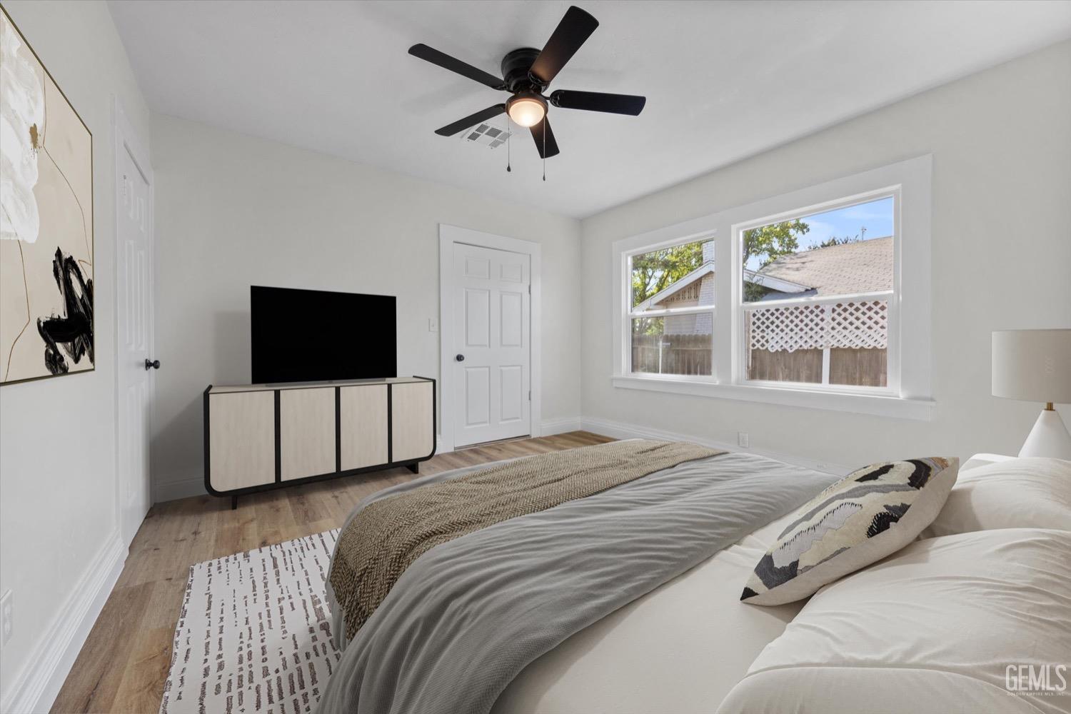 Undisclosed Address Bakersfield, CA 93304 - Photo 10 of 47 a bedroom with a bed and a flat screen tv