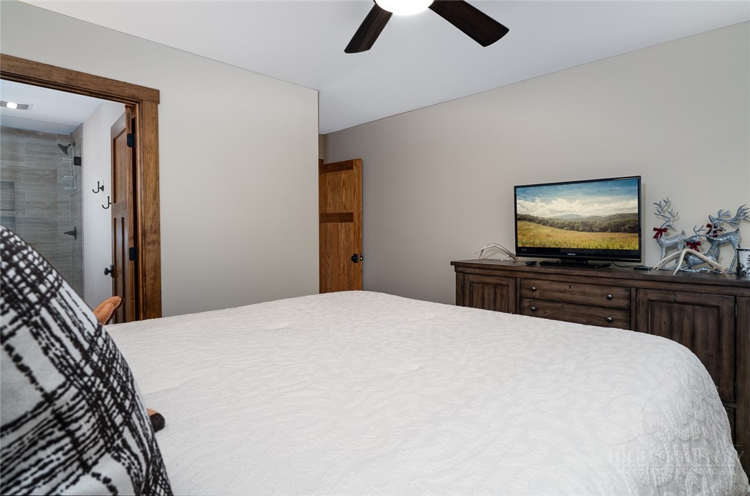 1161 Grandview Dr Extension Boone, NC 28607 - Photo 25 of 43 a bedroom with a bed and a flat screen tv