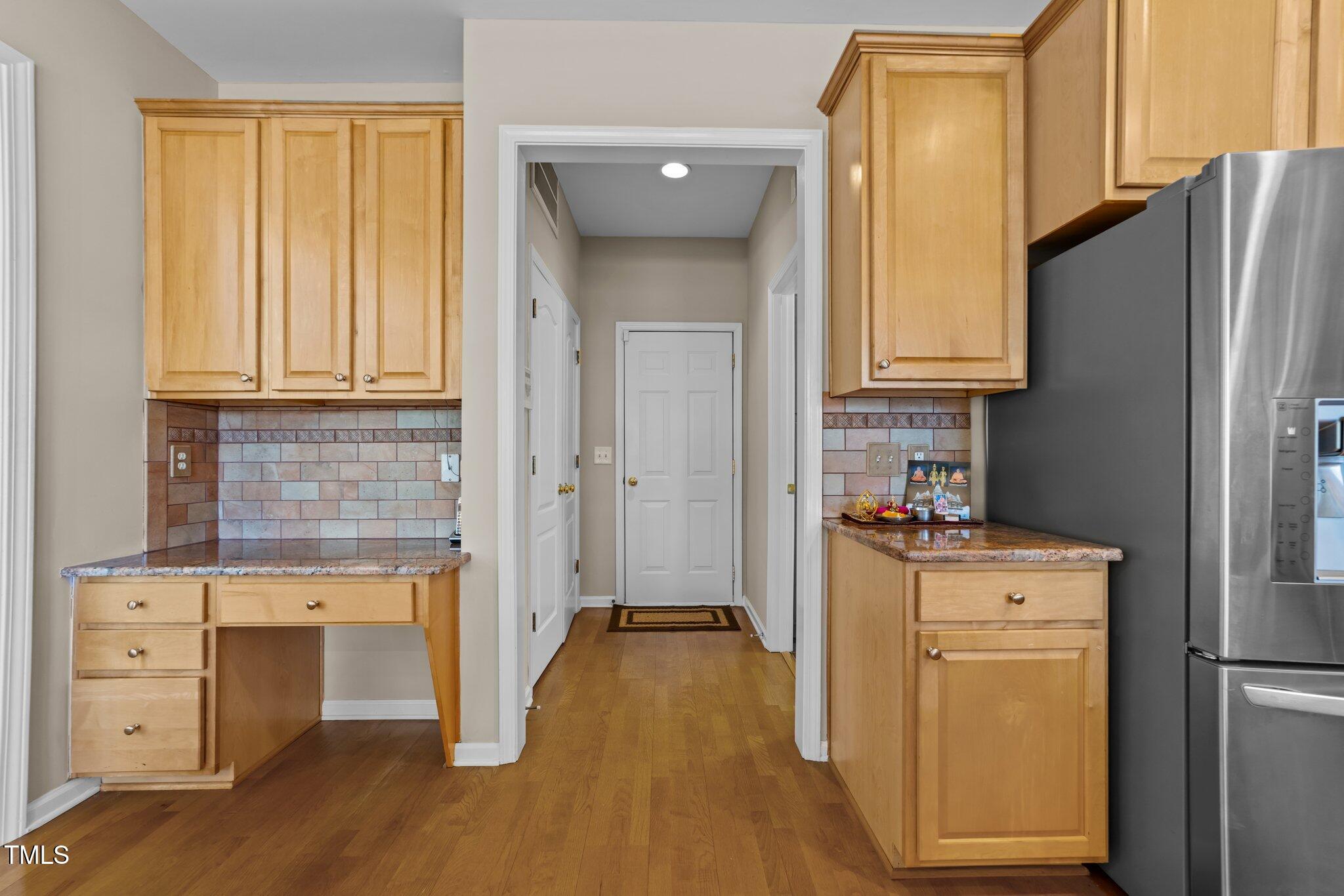5430 Wind Mountain Lane Raleigh, NC 27613 - Photo 13 of 48 a view of a kitchen with storage and utility