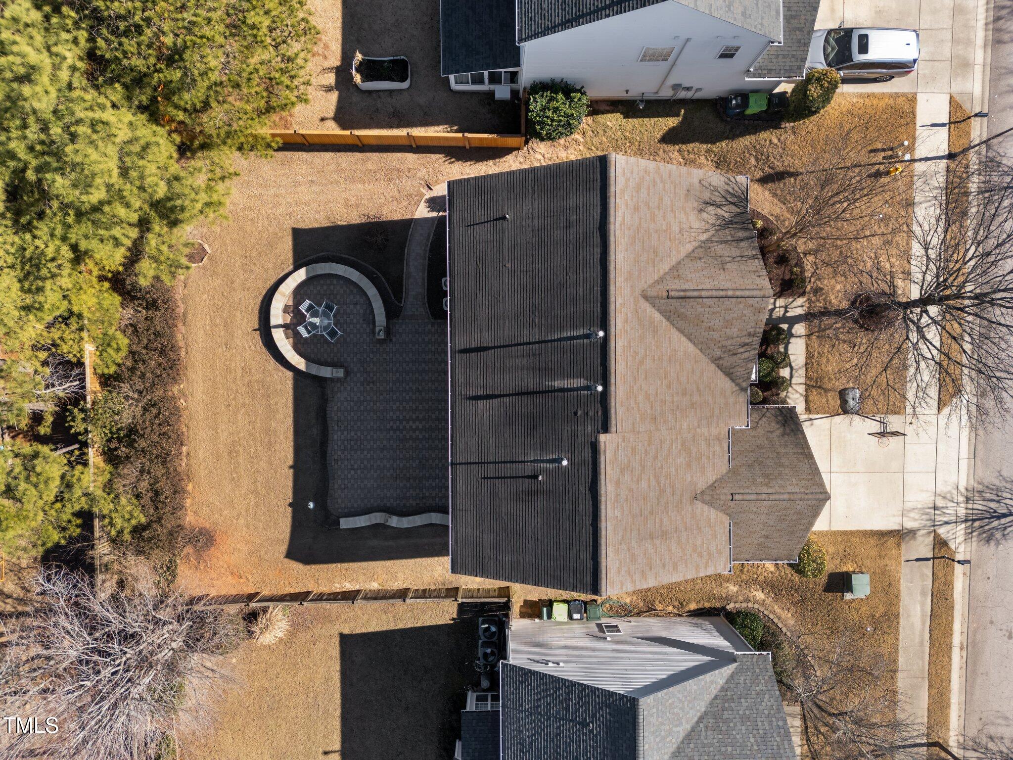 5430 Wind Mountain Lane Raleigh, NC 27613 - Photo 42 of 48 an aerial view of a fireplace with wooden fence