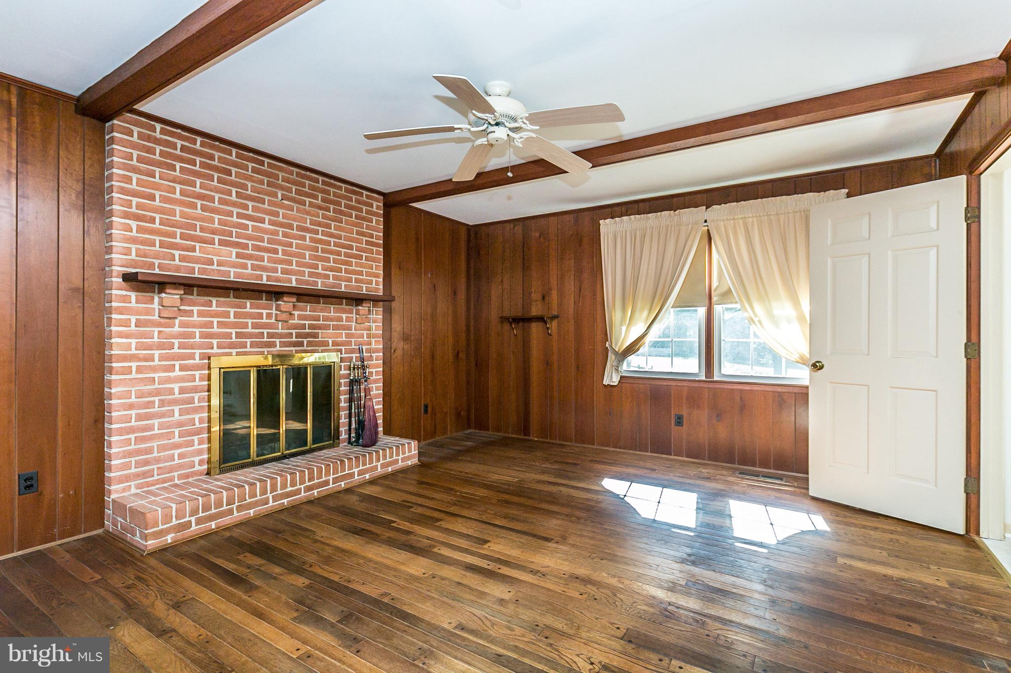 17217 Whiteley Road Monkton, MD 21111 - Photo 8 of 31 Family room with wood burning fireplace