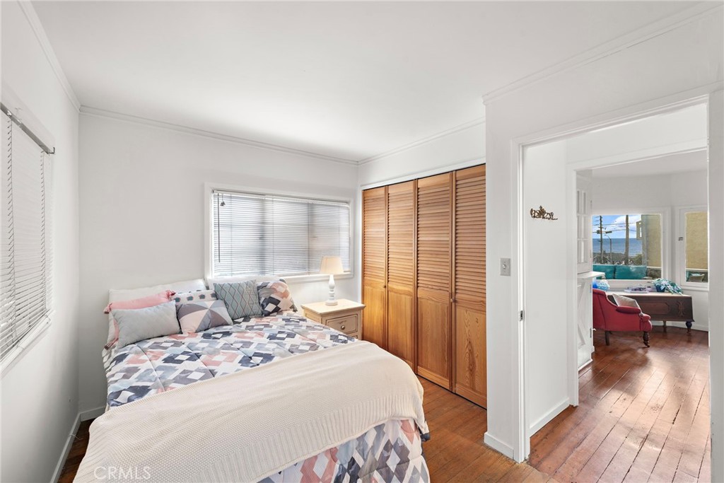 290 Diamond Street Laguna Beach, CA 92651 - Photo 12 of 30 a bedroom with a bed and a large window