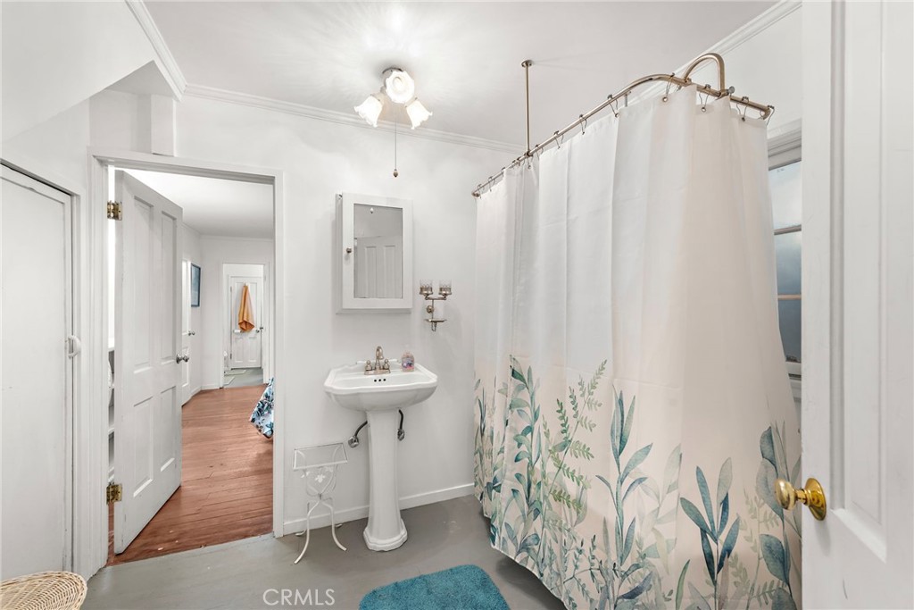 290 Diamond Street Laguna Beach, CA 92651 - Photo 13 of 30 a bathroom with a sink and mirror