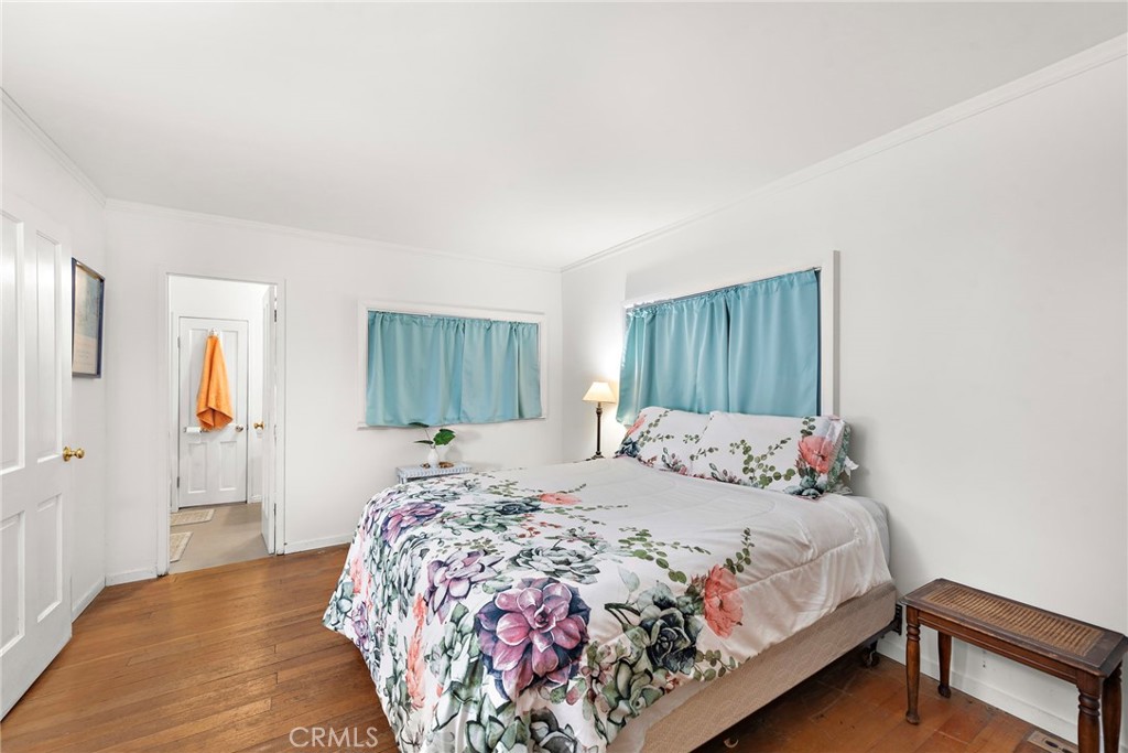 290 Diamond Street Laguna Beach, CA 92651 - Photo 14 of 30 a bedroom with a bed and a painting on the wall