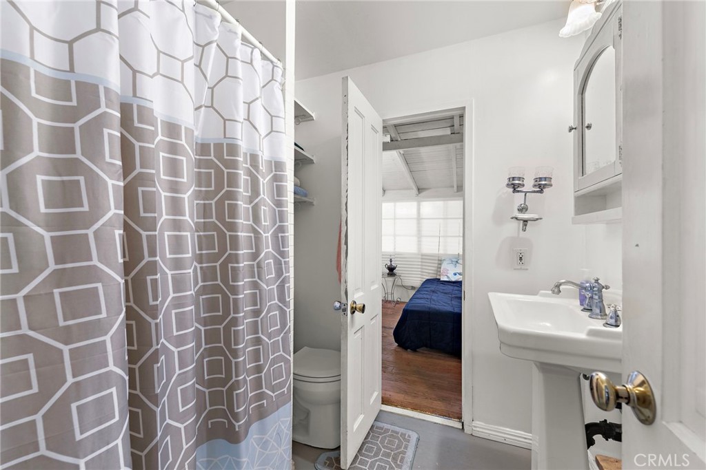 290 Diamond Street Laguna Beach, CA 92651 - Photo 15 of 30 a bathroom with a sink toilet and shower