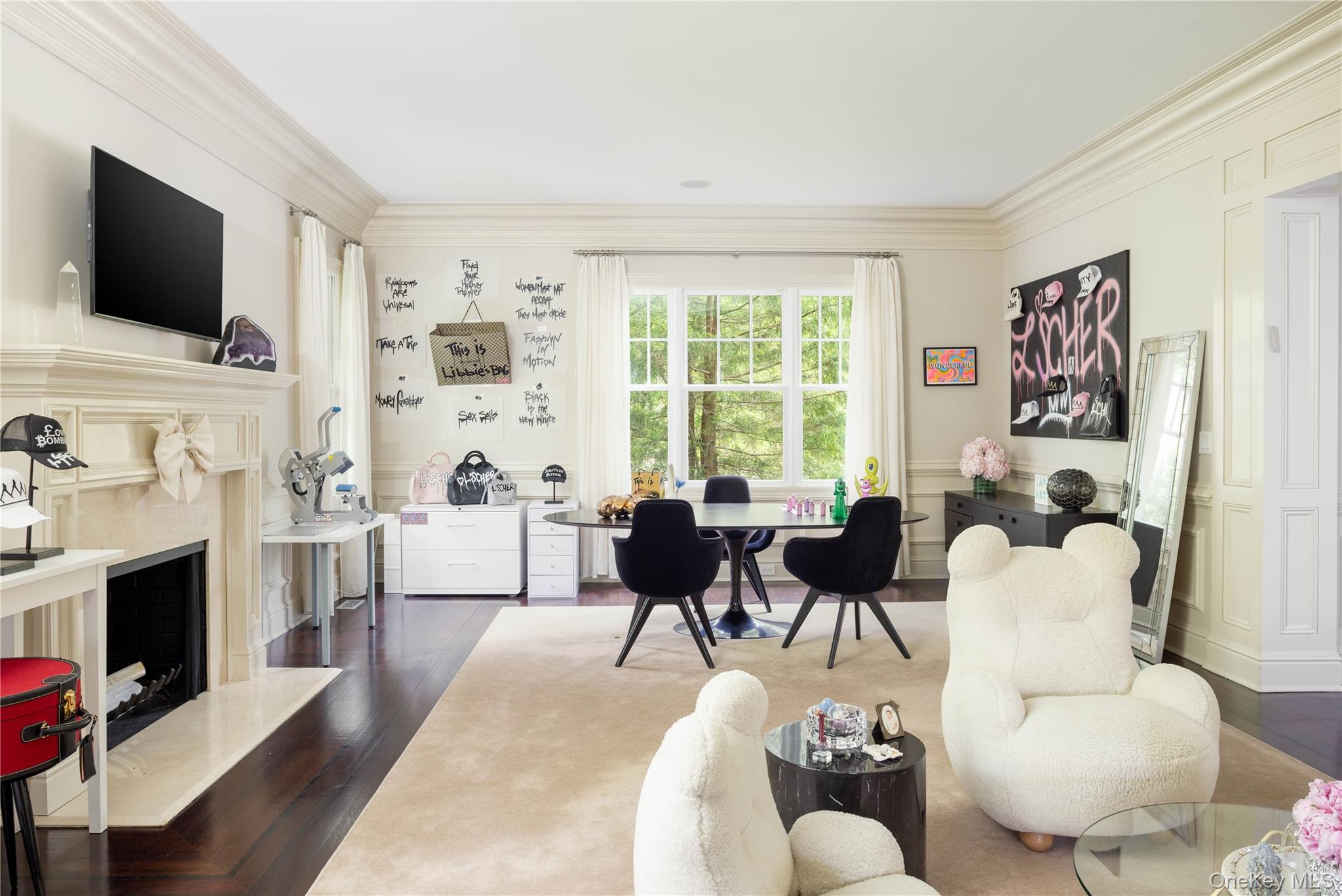 486 Middle Line Highway Bridgehampton, NY 11976 - Photo 10 of 25 a living room with furniture a flat screen tv and a fireplace