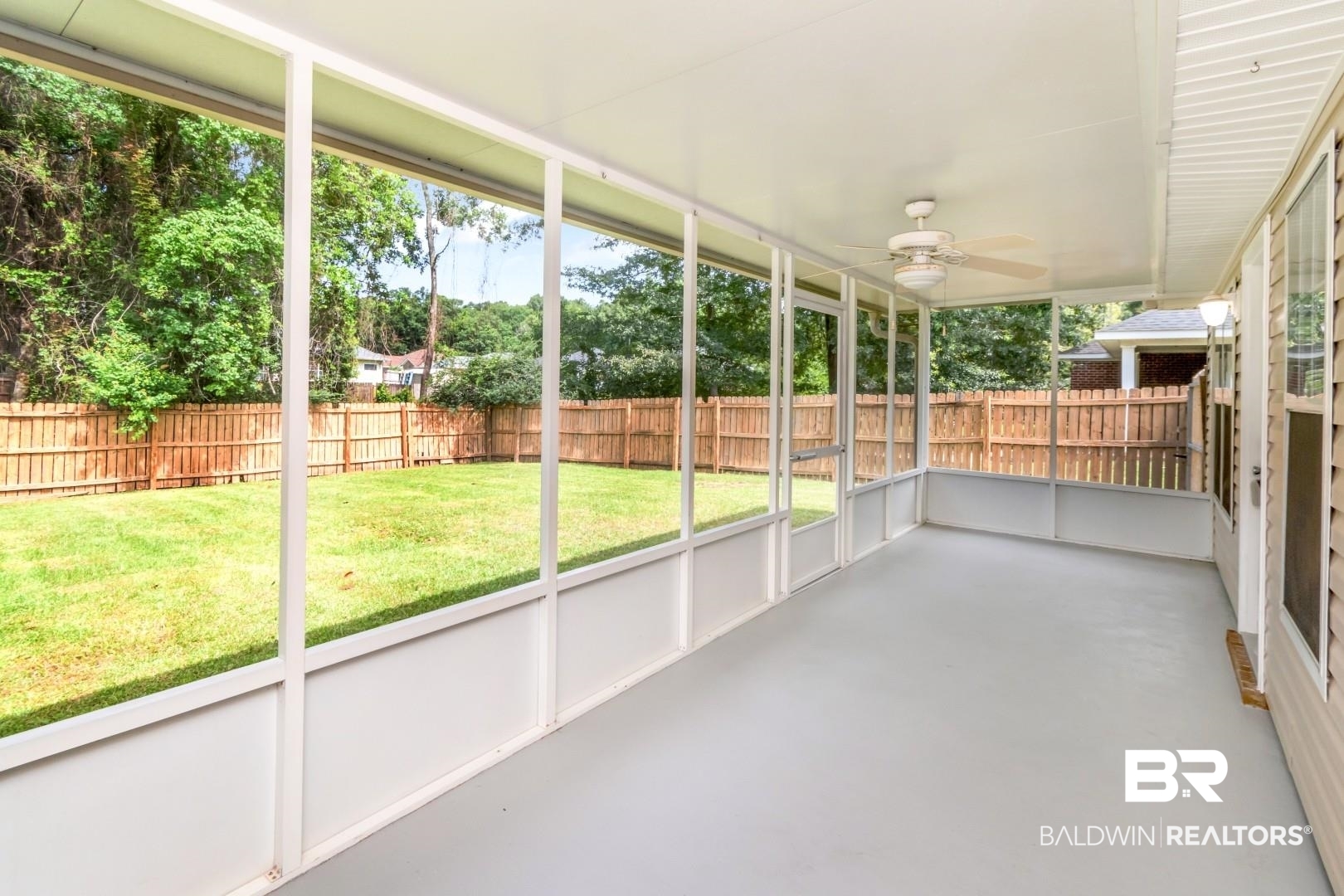 2136 Spring Grove Court Mobile, AL 36695 - Photo 30 of 38 Screened porch with a neutral-toned concrete floor, white ceiling, and a ceiling fan