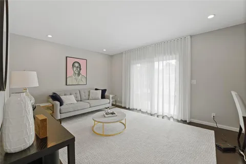 a kitchen with stainless steel appliances a refrigerator a sink dishwasher with a dining table and chairs