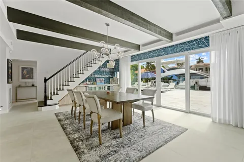 a living room with a couch and a refrigerator