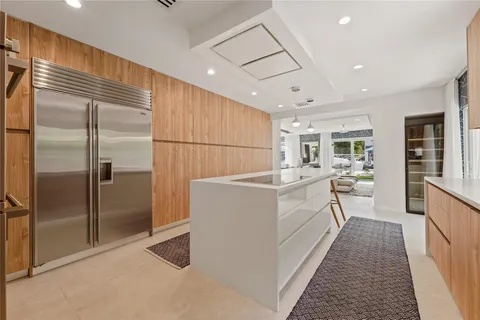 a bathroom with a shower and a sink