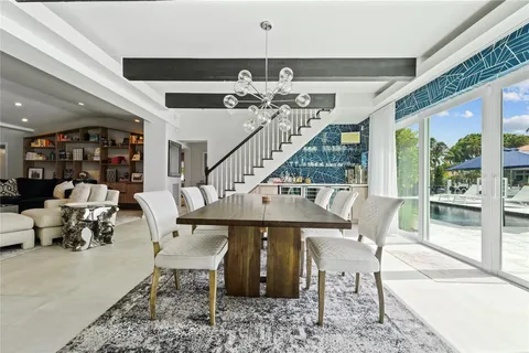a view of entryway with furniture and wooden floor