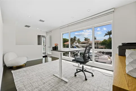 a bathroom with a bathtub shower sink and mirror