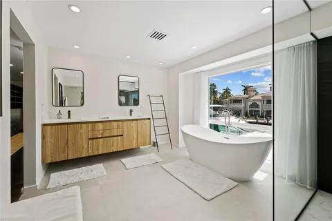 a view of a pathway with a flower garden