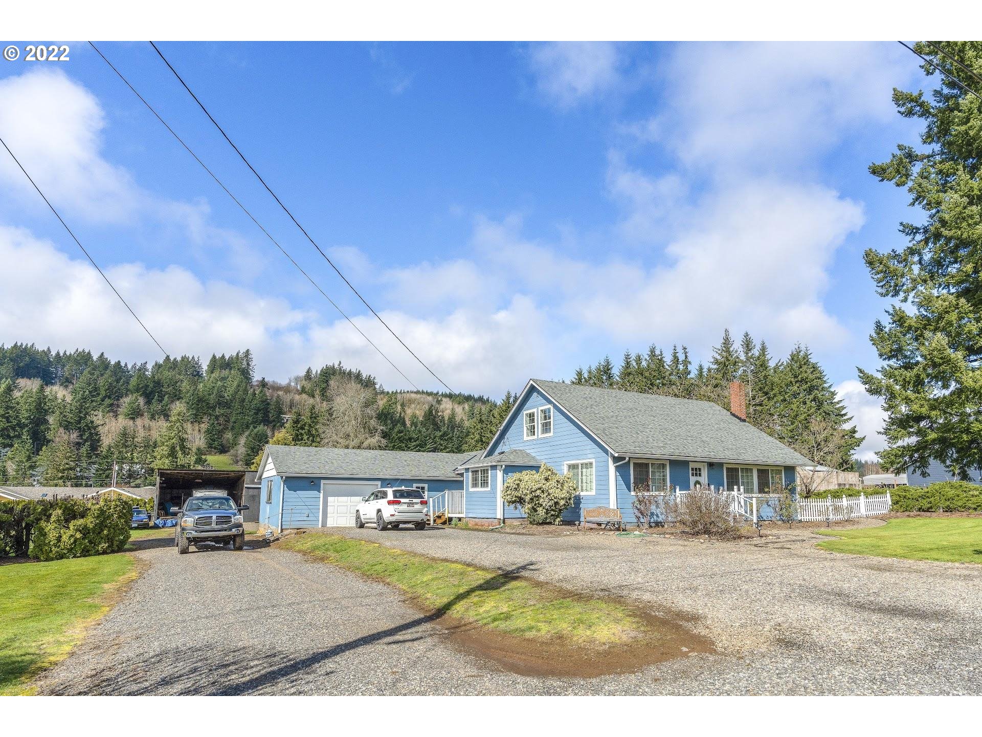 12275 Southeast School Avenue Boring, OR 97009 - Photo 1 of 14 a view of a big house with a big yard and potted plants