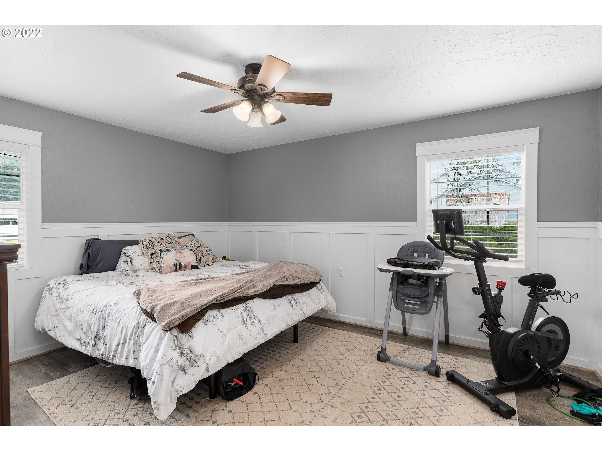 12275 Southeast School Avenue Boring, OR 97009 - Photo 13 of 14 a bedroom with a bed a desk and chair