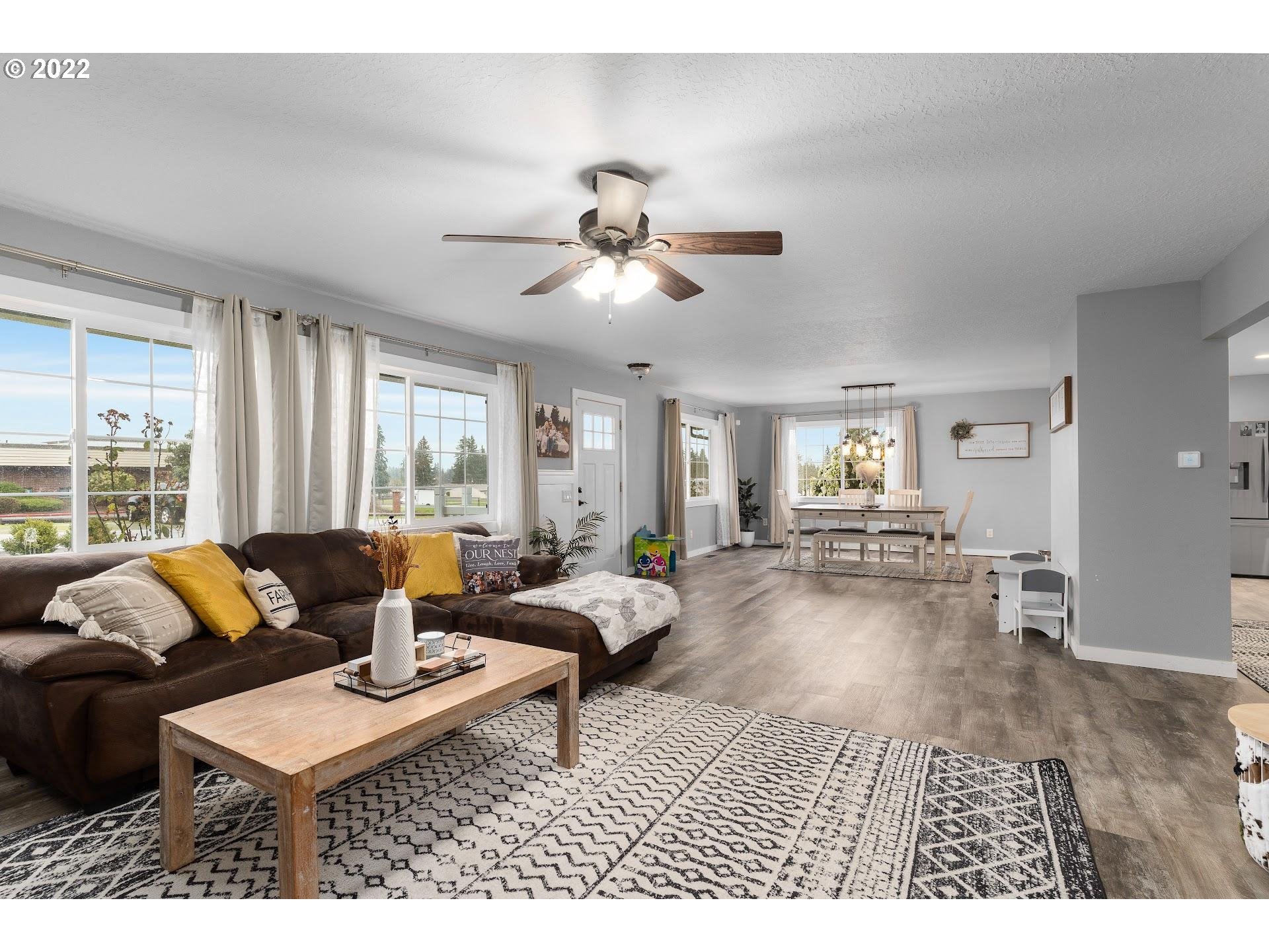 12275 Southeast School Avenue Boring, OR 97009 - Photo 5 of 14 a living room with furniture and a large window