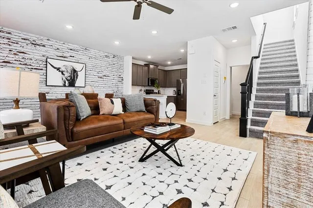 a living room with furniture and a rug