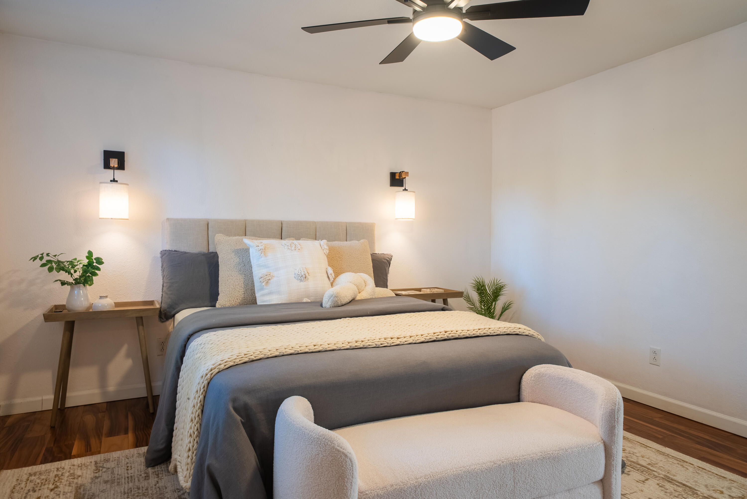 16879 Elsinore Road Bend, OR 97707 - Photo 25 of 48 a bedroom with a bed and a chandelier