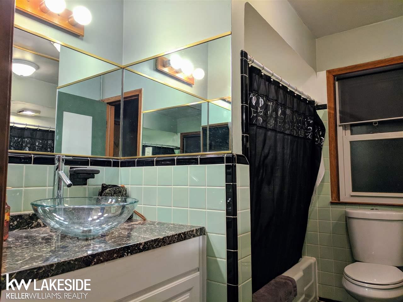 15580 Charles R Avenue Eastpointe, MI 48021 - Photo 17 of 23 Recent updates to this bathroom include a new vanity, sink and other features!