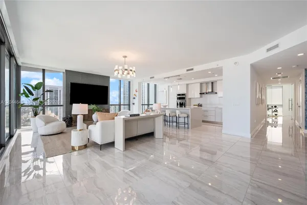 a living room with furniture and a flat screen tv