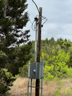 a view of a street with flower plants in front of main door