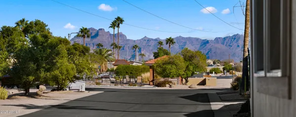 a view of a building with a tree in front