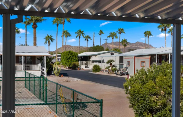 a view of a chairs and table in a patio