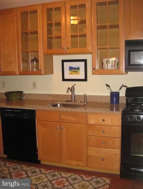 225 Overbrook Road Baltimore, MD 21212 - Photo 11 of 28 a kitchen with stainless steel appliances granite countertop a sink stove and cabinets