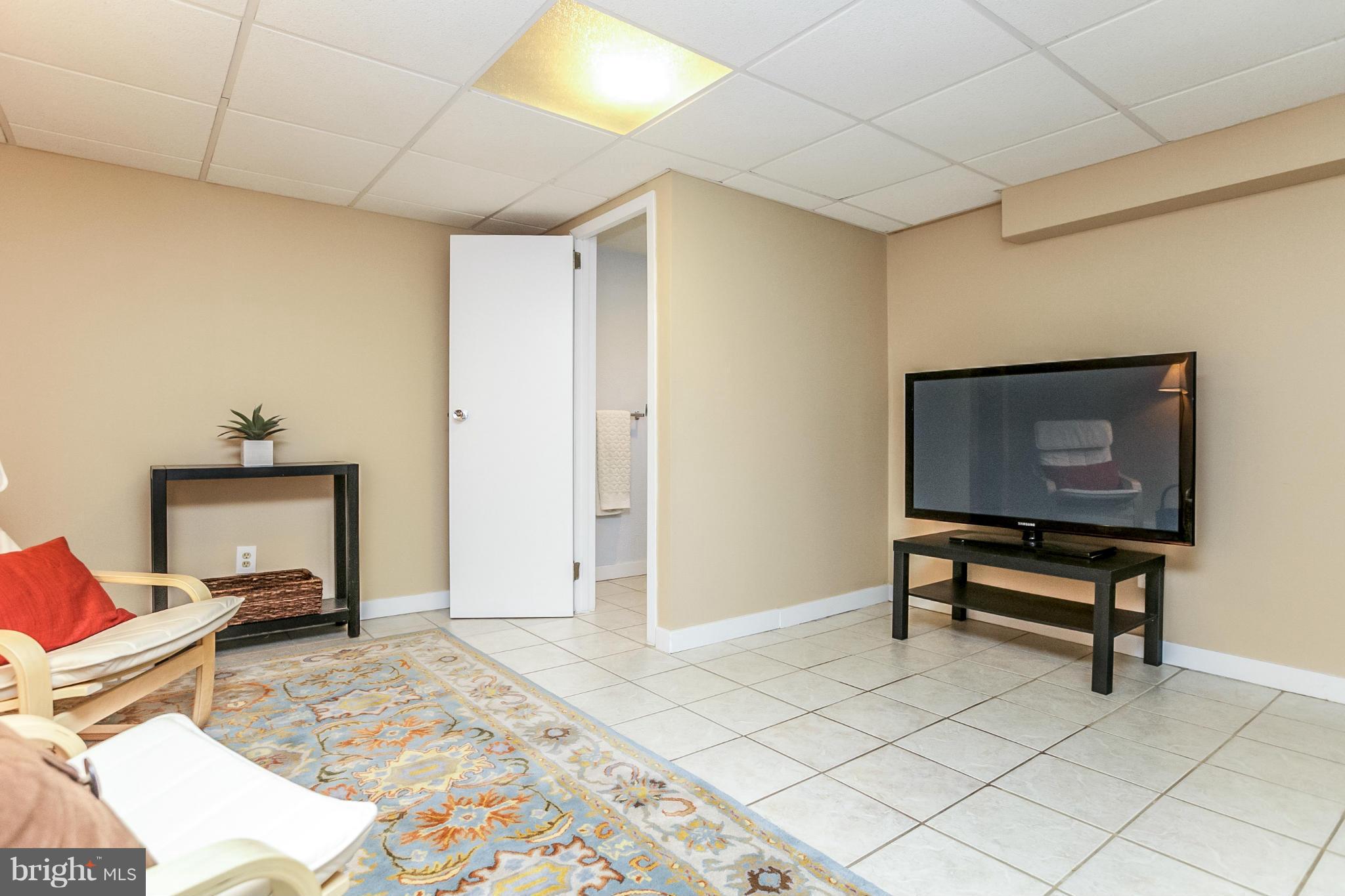 225 Overbrook Road Baltimore, MD 21212 - Photo 15 of 28 a bedroom with furniture and a window