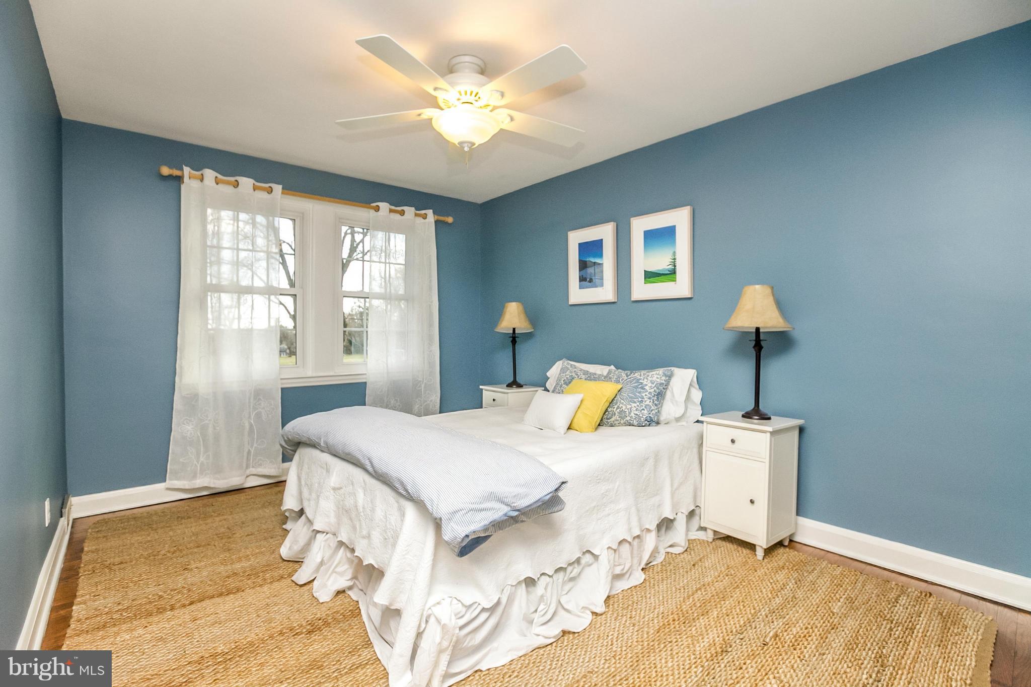 225 Overbrook Road Baltimore, MD 21212 - Photo 17 of 28 a bedroom with a bed chandelier and a window