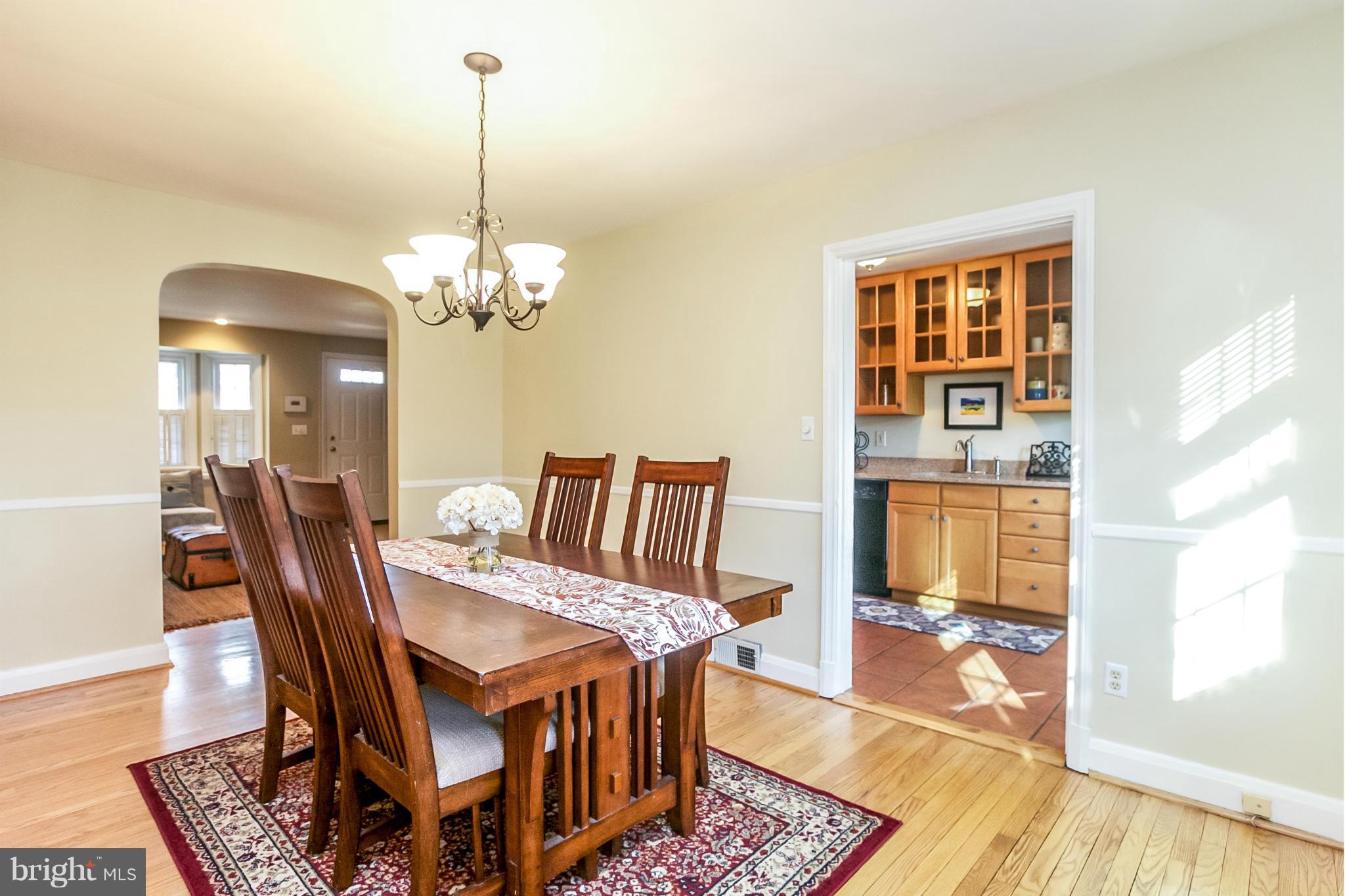 225 Overbrook Road Baltimore, MD 21212 - Photo 8 of 28 a dining room with furniture a rug and wooden floor