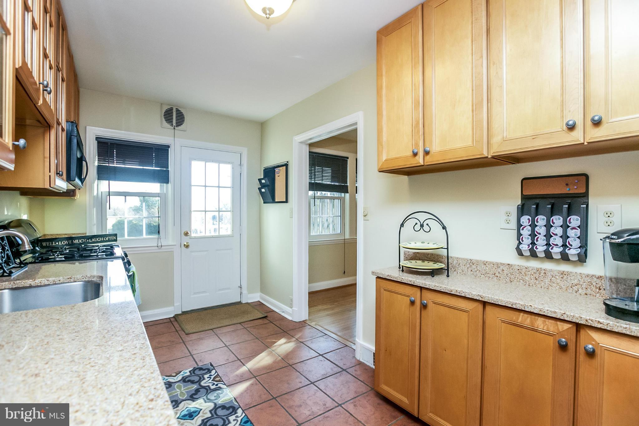 225 Overbrook Road Baltimore, MD 21212 - Photo 9 of 28 a kitchen with granite countertop a sink stainless steel appliances and cabinets