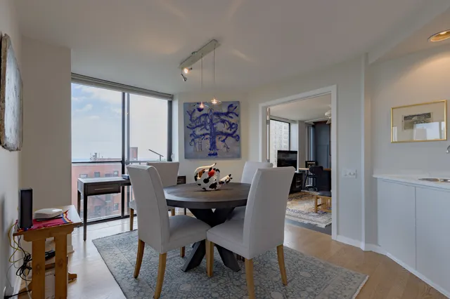 a dining room with furniture and window