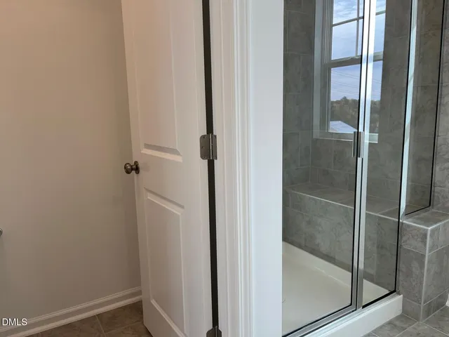 a bathroom with a glass door